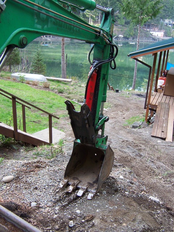 Takeuchi tb025 mini excavator with ht830 mini thumb stowed away in the folded position