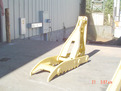 Yellow MT1240 mechanical excavator thumb