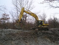 Side profile of MT2458 excavator thumb installed on a Cat excavator.