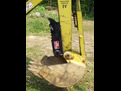 MT618 mini thumb in the folded position on a Terramite T5C compact loader backhoe