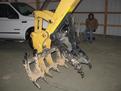 USA Attachments MT830 mini thumb installed with excavator tree stumper and rake