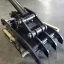 Progressive link excavator thumb