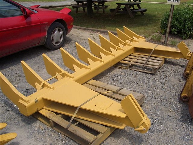 DR-116-10-5x5 Dozer Root Rake near a red car