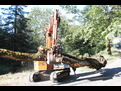 HT1035 hydraulic thumb inst alled on an excavator with a purple bucket