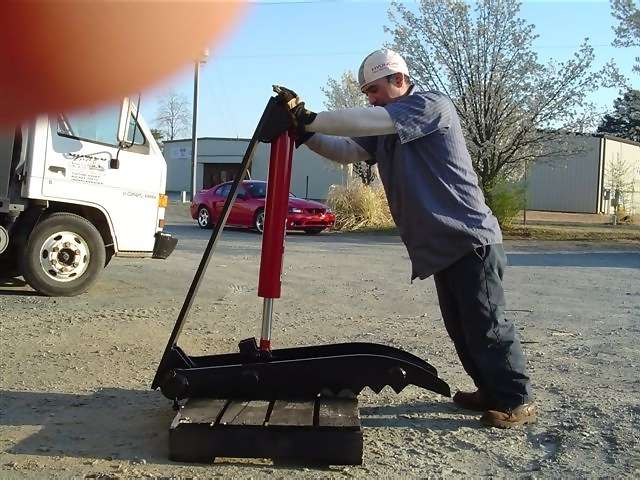 HT1240 hydraulic excavator thumb beside a person