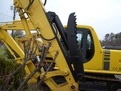 HT1850 hydraulic excavator thumb with black hydraulic cylinder installed on an excavator