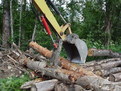 HT830 mini excavator thumb just moved some logs