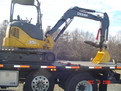 Hydraulic 8\" x 30\" mini excavator thumb installed on a Deere 35D mini excavator