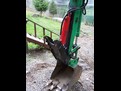 HT830 mini thumb installed on a green excavator.