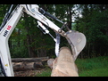 USA Attachments ht830 excavator thumb on a TEREX HR16 mini excavator