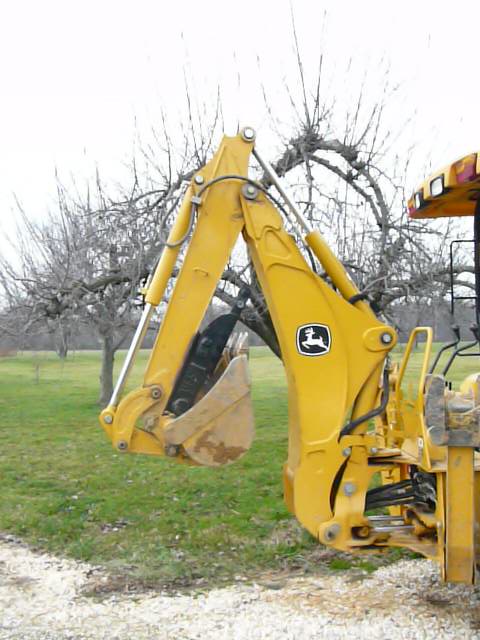 MT618 mini thumb installed on a deere compact loader backhoe