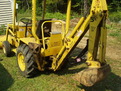 Terramite T5C compact loader backhoe with MT618 mini thumb by USA Attachments