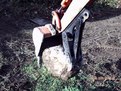 6"x18" mini thumb on Kubota kh-41 mini excavator grasps a stone
