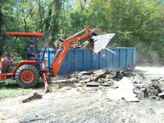 MT824 mini thumb thumb installed on a Kubota L35 tractor backhoe