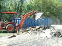 MT824 mini thumb thumb installed on a Kubota L35 tractor backhoe