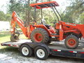 KUBOTA L35 tractor backhoe with MT824 Mini thumb by USA Attachments