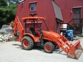 8\" x 24\" thumb installed on a Kubota L39 backhoe