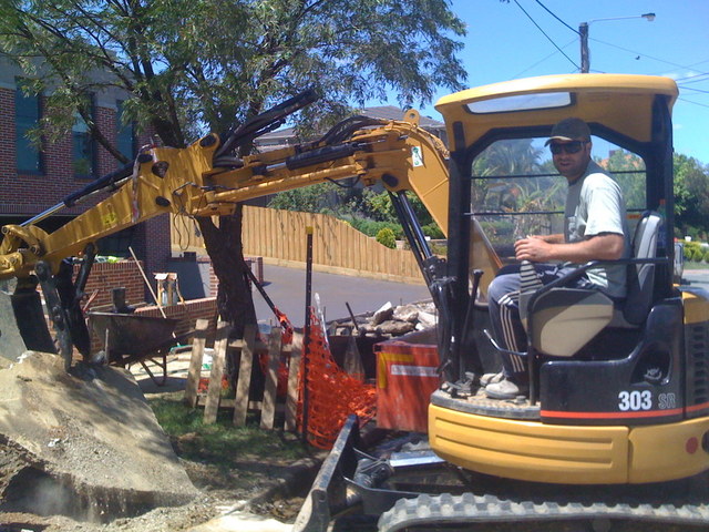 CAT 303 SR mini excavator thumb removing concrete with MT830 mini thumb