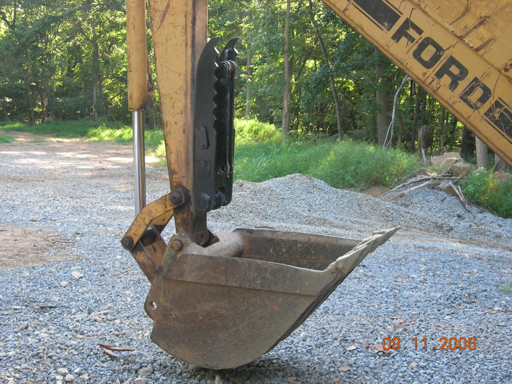 Ford backhoe with MT830, 8"x30" mini thumb