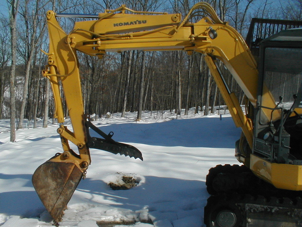 Komatsu mini excavator with mt830 thumb in the snow