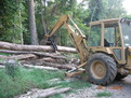 FORD loader BACKHOE with 8"x30" thumb picks up log