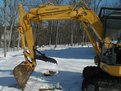 komatsu mini excavator with mt830 thumb in the snow