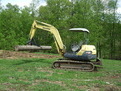 8" x 30" excavator thumb installed on a Komatsu PC40 excavator