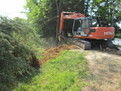 Tree stumper installed on Hitachi ex120 stumping trees